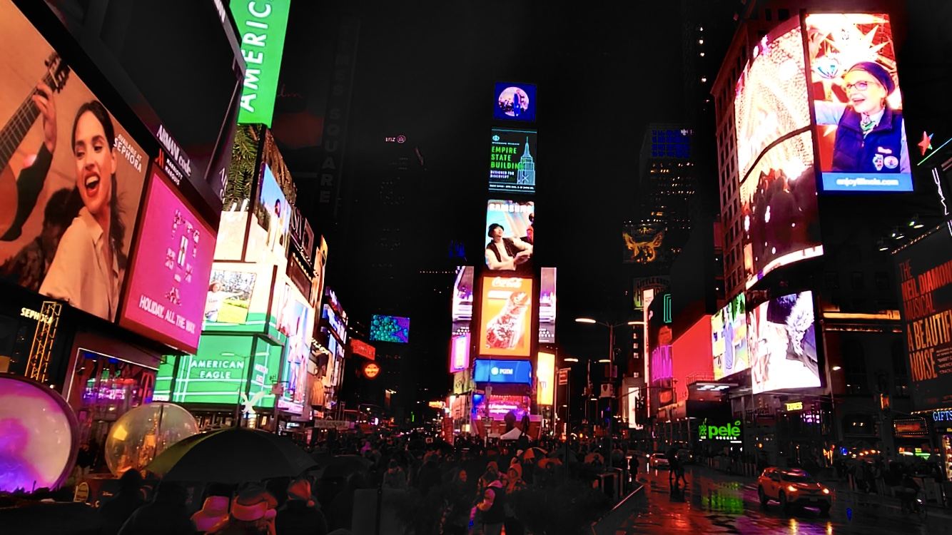 Times Square lights and crowd; contextual advertising photograph, not a campaign image. Photo: